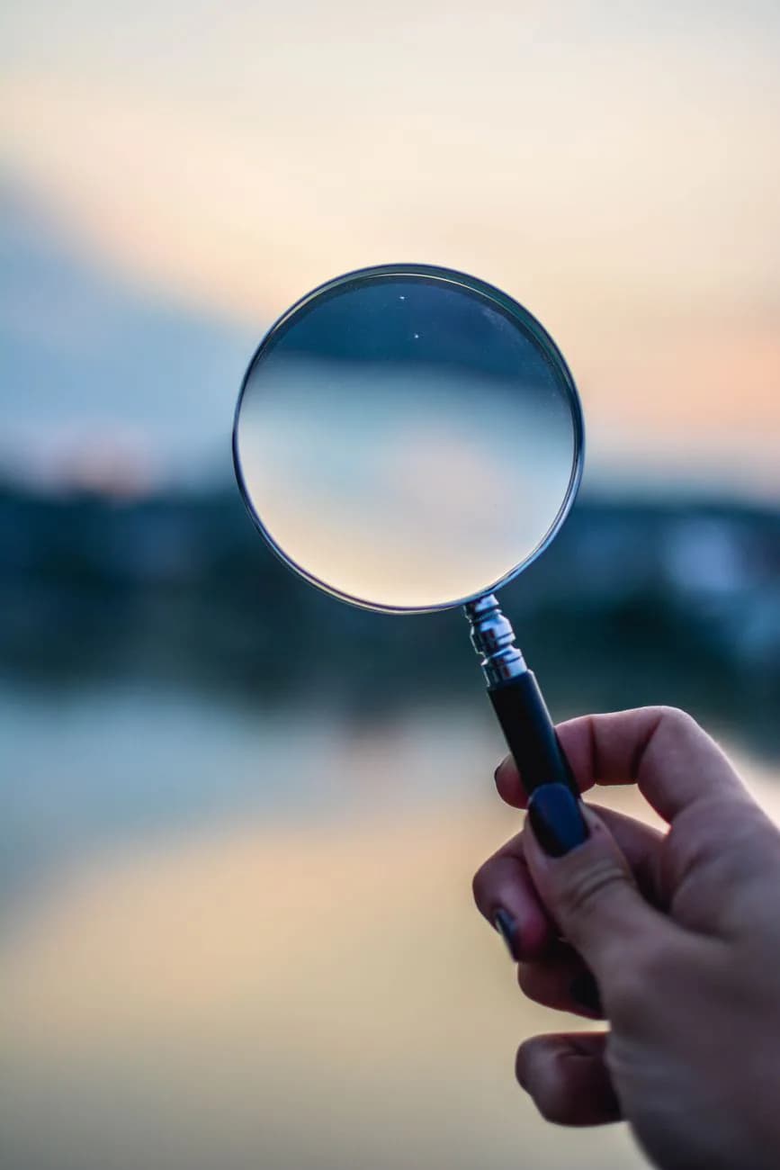 A magnifying glass representing the search for answers